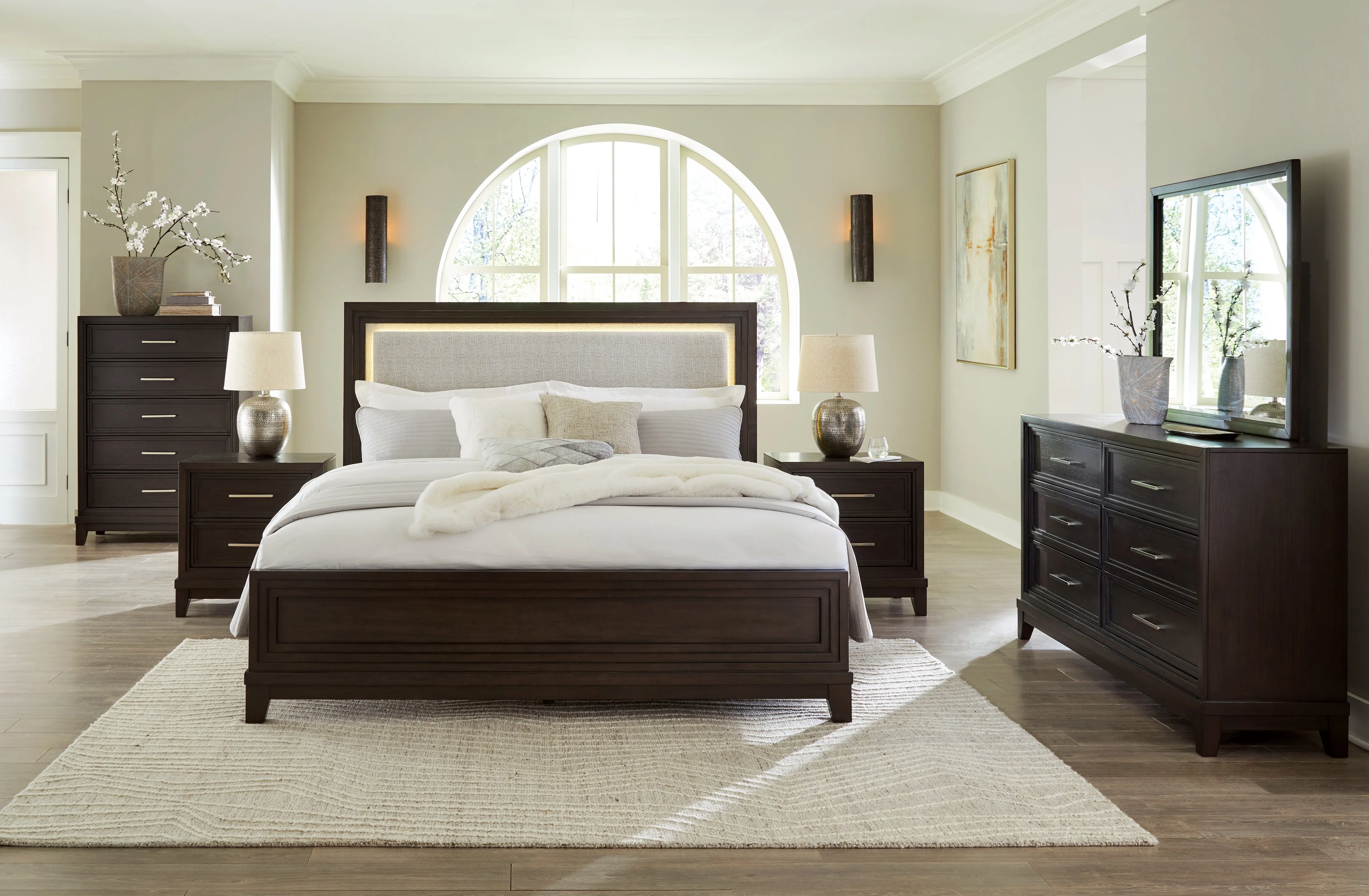 Neymorton King Upholstered Panel Bed with Mirrored Dresser and Nightstand in Dark Grayish Brown